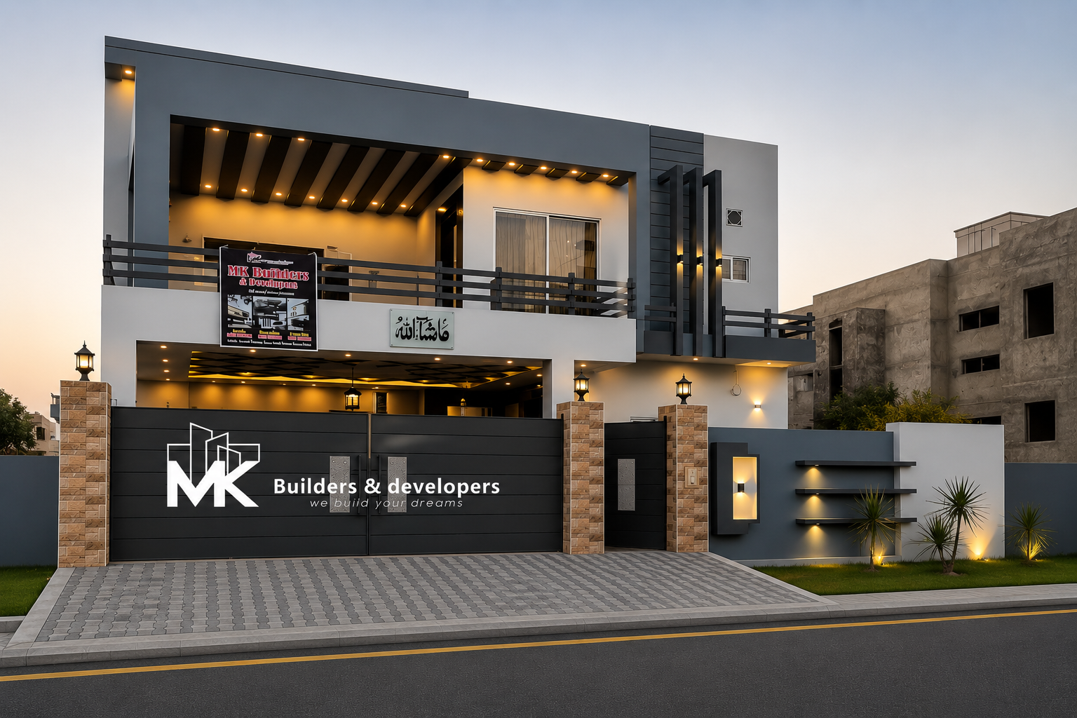 A completed two-storey MK Builders home at dusk — grey and white façade with warm-lit balconies and terraces, a paved forecourt, and the MK Builders & Developers name on the front gate.
